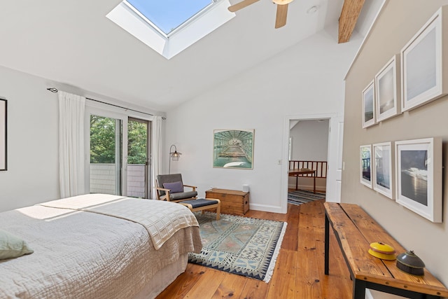 130 Daniels Dr, Wellfleet, MA 02667 - bedroom featuring hardwood / wood-style floors, high vaulted ceiling, a skylight, and ceiling fan