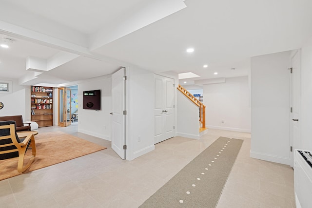 130 Daniels Dr, Wellfleet, MA 02667 - finished basement with stairway, recessed lighting, and light tile patterned flooring