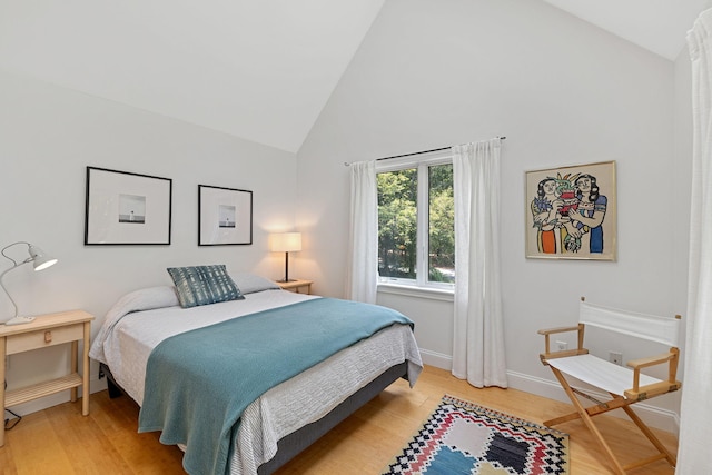 130 Daniels Dr, Wellfleet, MA 02667 - bedroom featuring high vaulted ceiling and light wood-style flooring