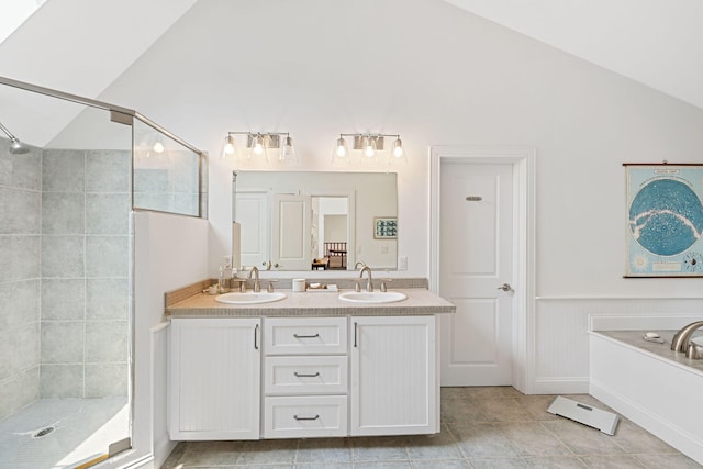 130 Daniels Dr, Wellfleet, MA 02667 - bathroom with vaulted ceiling, a tile shower, double vanity, and tile patterned floors