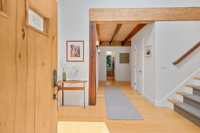 130 Daniels Dr, Wellfleet, MA 02667 - entryway with light wood-style flooring, a wood ceiling with exposed beams, and stairs