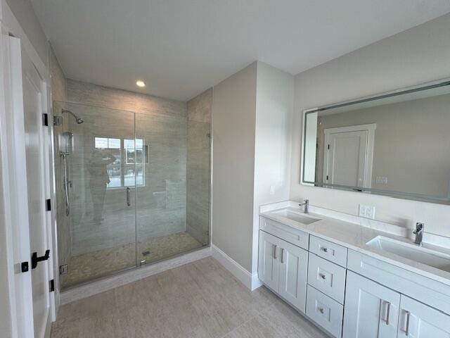 bathroom with vanity and walk in shower