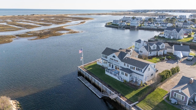 birds eye view of property with a residential view and a water view