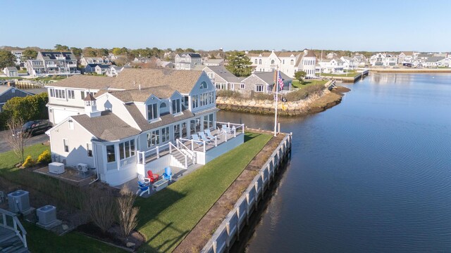 aerial view with a residential view and a water view