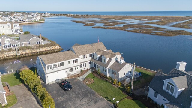 bird's eye view with a residential view and a water view