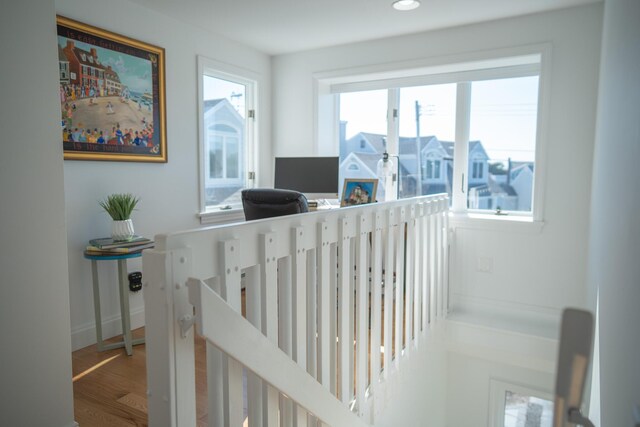 stairs with baseboards, recessed lighting, and wood finished floors