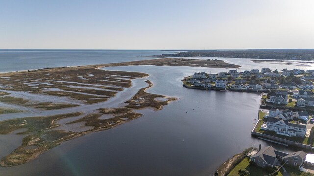 birds eye view of property with a water view and a residential view