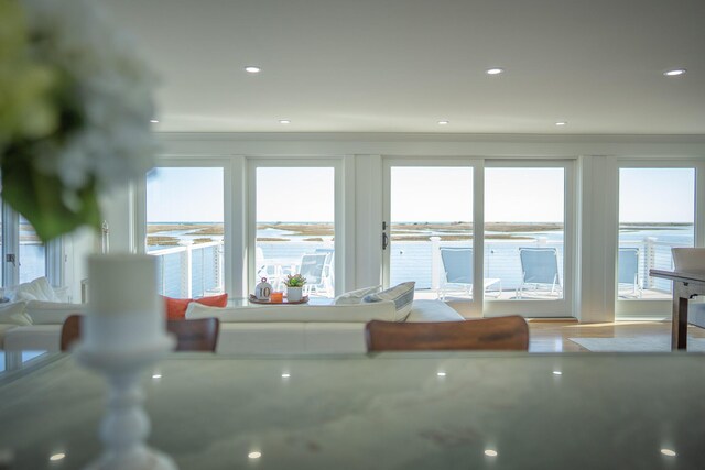 living area with plenty of natural light and crown molding