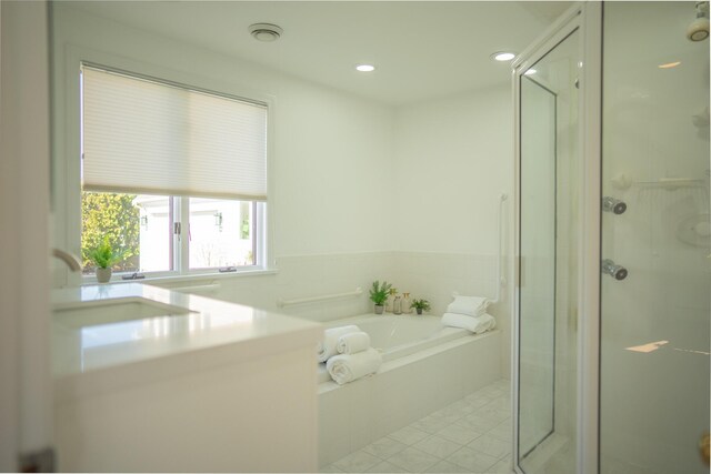 full bath featuring tile patterned flooring, vanity, recessed lighting, a bath, and a stall shower