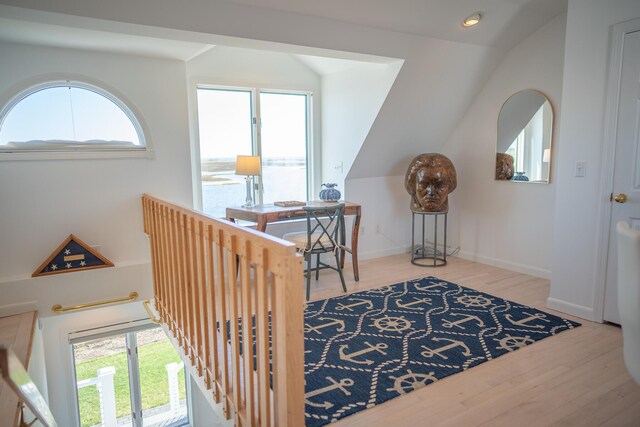 interior space with recessed lighting, wood finished floors, and lofted ceiling