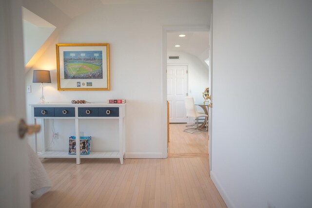 corridor featuring recessed lighting, baseboards, visible vents, and light wood finished floors