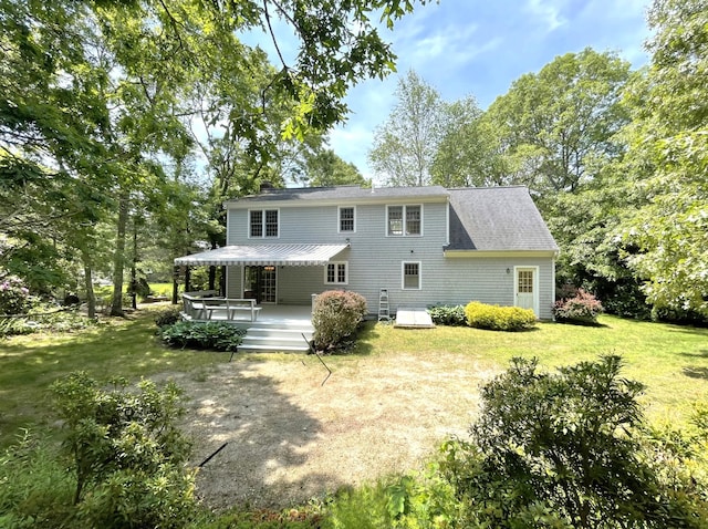 40 Appaloosa Way, Marstons Mills, MA 02648 - rear view of house featuring a wooden deck and a lawn