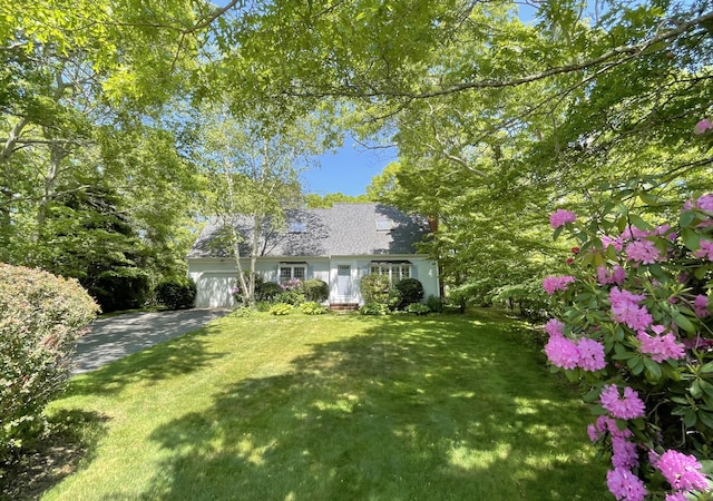 40 Appaloosa Way, Marstons Mills, MA 02648 - cape cod home featuring a front yard and an attached garage