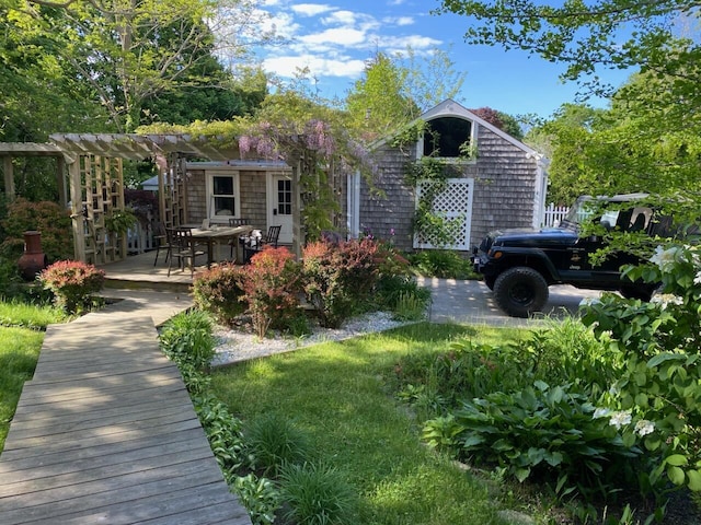 exterior space with a patio and a pergola