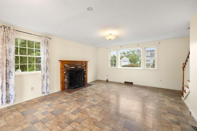 75 Wing Blvd E, East Sandwich, MA 02537 - unfurnished living room with stairway, a fireplace, and stone finish flooring