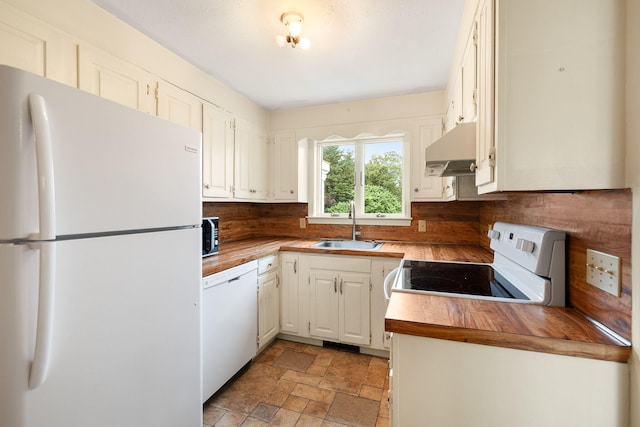 75 Wing Blvd E, East Sandwich, MA 02537 - kitchen featuring white appliances, extractor fan, wood counters, light stone finish floors, and tasteful backsplash