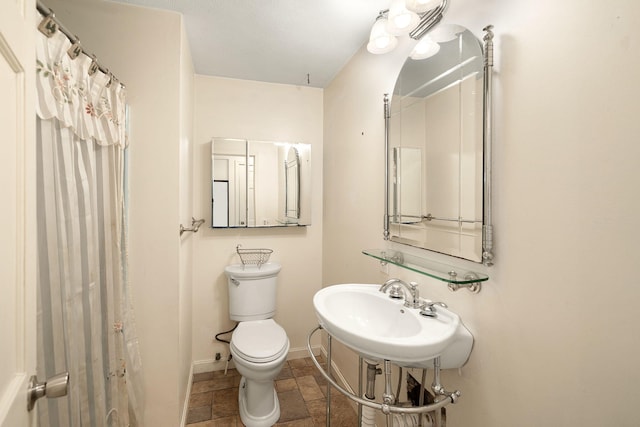 75 Wing Blvd E, East Sandwich, MA 02537 - bathroom with stone tile flooring and toilet