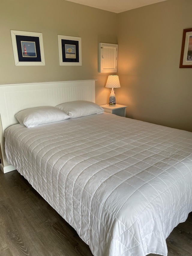 bedroom featuring dark hardwood / wood-style flooring