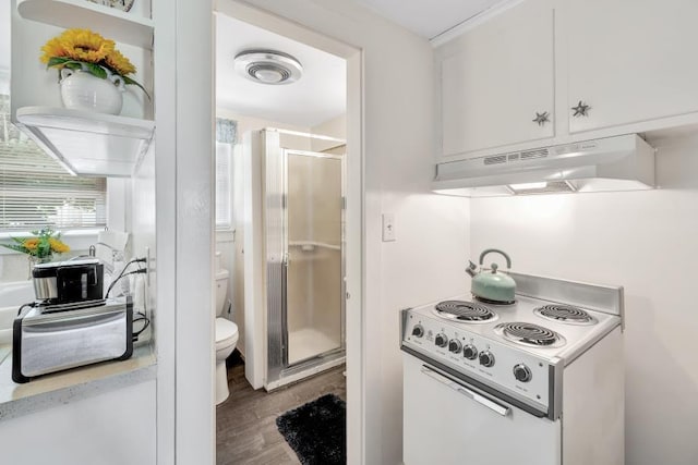 kitchen with white cabinetry, white electric range oven, and hardwood / wood-style floors