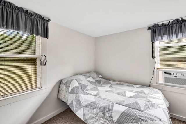 bedroom featuring cooling unit and carpet