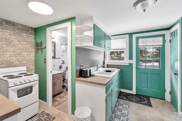 kitchen featuring sink and white range with electric stovetop