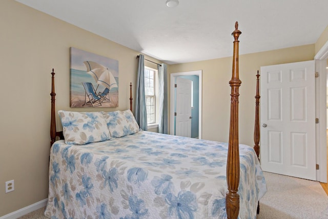 carpeted bedroom with baseboards