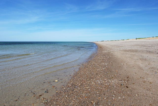 property view of water featuring a beach view