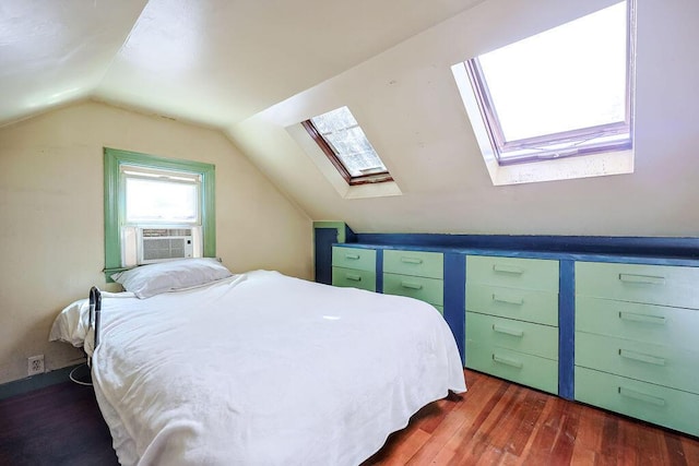 bedroom with cooling unit, dark wood-style flooring, and lofted ceiling