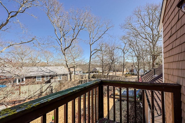 wooden terrace featuring fence private yard and a residential view