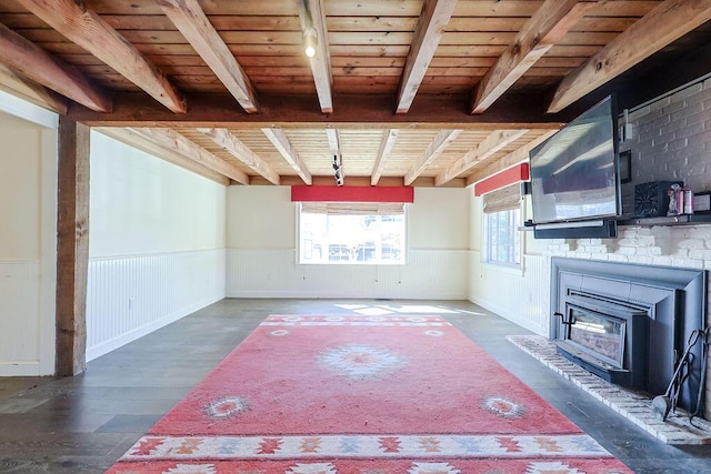 basement with wood ceiling, wood finished floors, and wainscoting