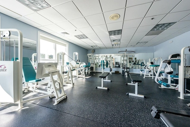 exercise room with a drop ceiling