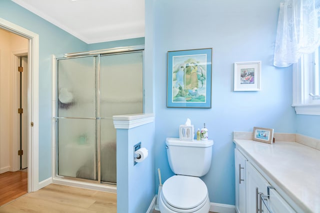 14 Harold St Unit 6-D, Harwich Port, MA 02646 - bathroom with vanity, wood-type flooring, a shower with shower door, and toilet