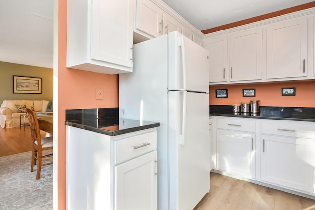 14 Harold St Unit 6-D, Harwich Port, MA 02646 - kitchen with white refrigerator, white cabinets, and light wood-type flooring