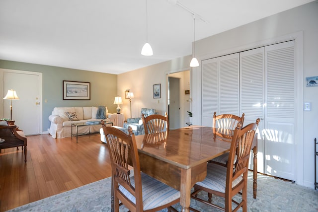 14 Harold St Unit 6-D, Harwich Port, MA 02646 - dining room featuring light hardwood / wood-style flooring and track lighting