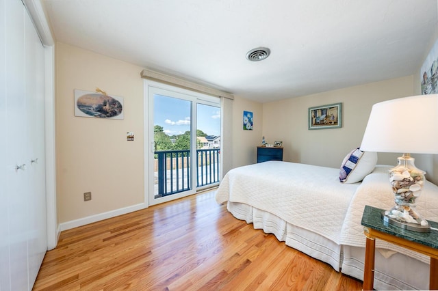 bedroom with light hardwood / wood-style flooring and access to outside