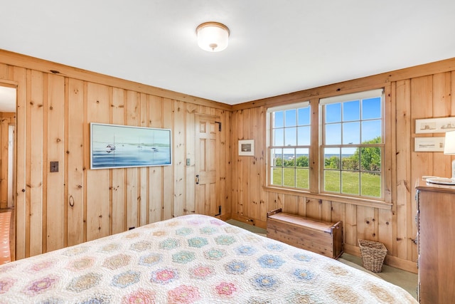 bedroom with wood walls