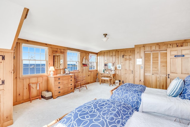 bedroom featuring carpet floors and wooden walls