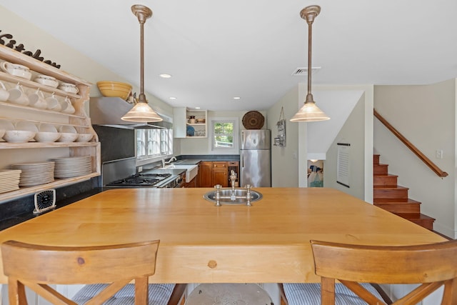 63 Briar Spring Rd, Orleans, MA 02653 - kitchen with stainless steel appliances, open shelves, pendant lighting, recessed lighting, and extractor fan