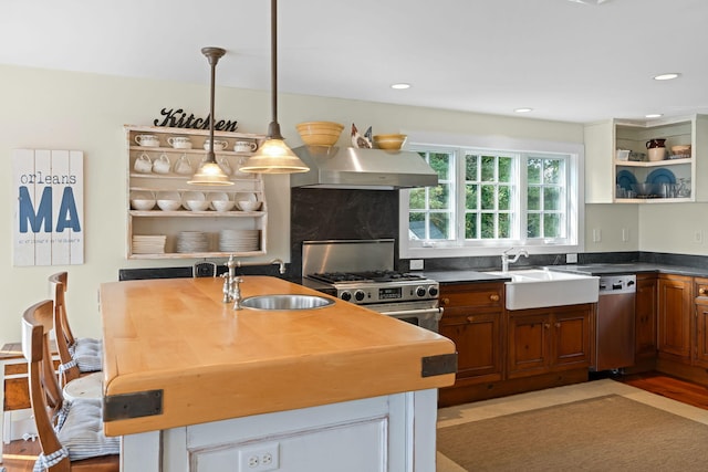 63 Briar Spring Rd, Orleans, MA 02653 - kitchen featuring extractor fan, appliances with stainless steel finishes, open shelves, a kitchen island with sink, and pendant lighting