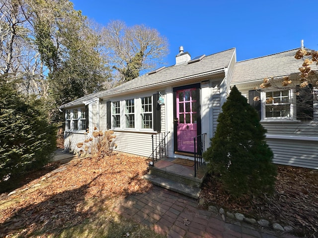 ranch-style house with a chimney