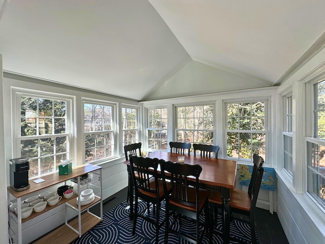 sunroom / solarium featuring lofted ceiling