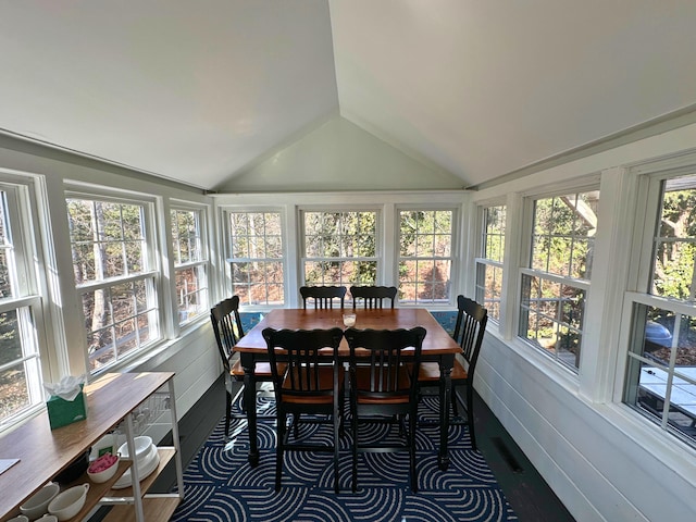 sunroom / solarium featuring lofted ceiling