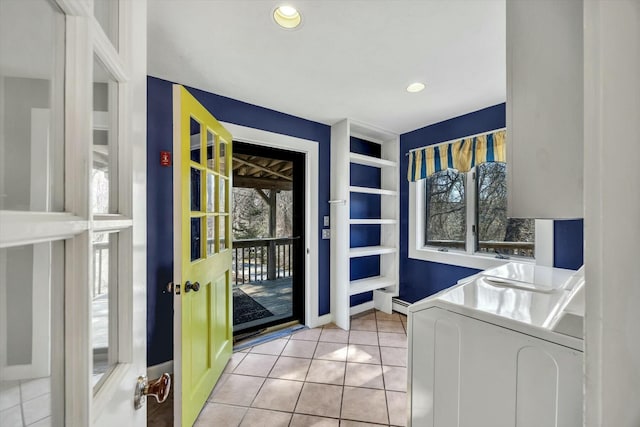 entryway featuring light tile patterned floors, recessed lighting, baseboards, and washer and dryer