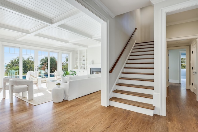 71 Towhee Ln, Orleans, MA 02653 - interior space featuring beamed ceiling, plenty of natural light, a fireplace, and wood finished floors