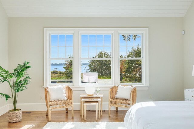 71 Towhee Ln, Orleans, MA 02653 - bedroom featuring baseboards, multiple windows, and wood finished floors