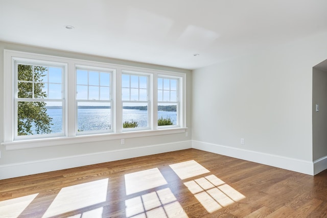 71 Towhee Ln, Orleans, MA 02653 - spare room featuring baseboards, a water view, and wood finished floors