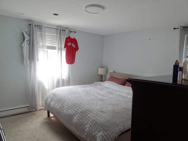 carpeted bedroom featuring baseboard heating