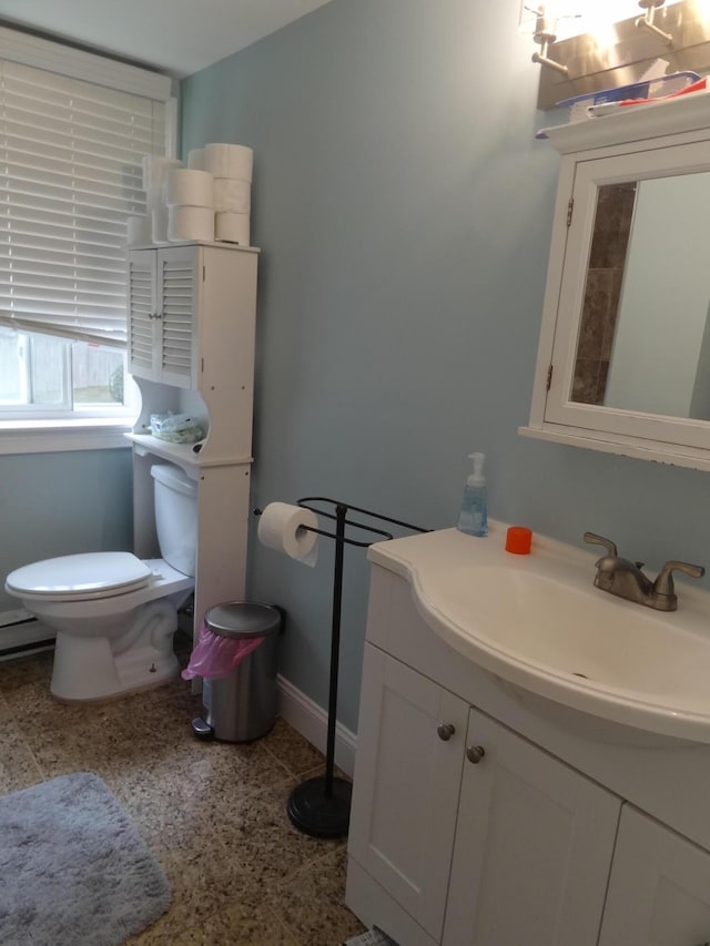 bathroom featuring toilet and vanity