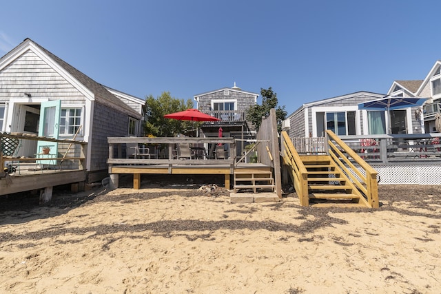 back of house featuring a deck