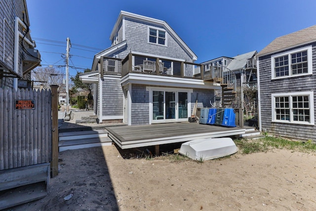 rear view of house with a wooden deck